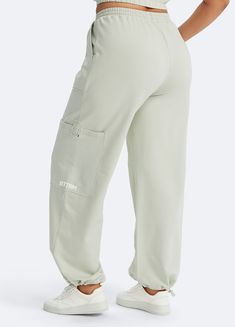 Embrace roomy wide legs and a stretchy fit for ultimate comfort, paired with a flattering high waist for added style. Whether it's grocery runs, lazy Sundays, or a casual hangout, these joggers have you covered in relaxed elegance. Loosely Fitted Cargo Sweatpants For Loungewear, Relaxed Fit Wide Leg Lounge Pants With Cargo Pockets, Relaxed Fit Full Length Cargo Pants For Loungewear, Relaxed Fit High-waisted Cargo Pants For Loungewear, Sporty High-waisted Relaxed Fit Bottoms, Relaxed Fit High-waisted Athleisure Bottoms, High-waisted Relaxed Fit Athleisure Bottoms, High-waisted Athleisure Bottoms With Relaxed Fit, Comfortable Wide Leg Joggers With Side Pockets