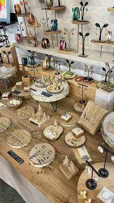 the table is full of different kinds of items on display for sale at the store