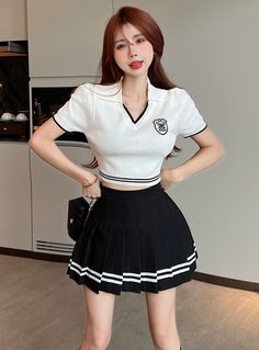 It looks good with a high-waisted skirt or pants.  	 Perfect for catching up with friends  	 Embroidered detail  	 Short sleeves  	 Slim fit Catching Up With Friends, Cropped Polo Shirt, Blue Stripes Pattern, Kpop Shirts, Fashion Chingu, Cropped Polo, Cropped Puffer Jacket, Printed Polo Shirts, Twist Top