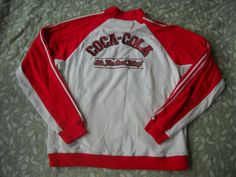 Coca Cola Track Jacket, Cotton Knit in Size Large, Coca Cola Brand with tons of applique and embroidery, It's The real Thing, front zipper White Embroidered Crew Neck Outerwear, Casual Long Sleeve Outerwear With Machine Embroidery, Coca Cola Brands, Track Jacket, Cotton Knit, Track Jackets, Coca Cola, Motorcycle Jacket, Front Zipper