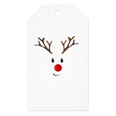 a white gift tag with reindeer's face drawn on it