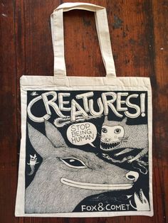 a tote bag with an image of a fox and a deer on it that says creatures