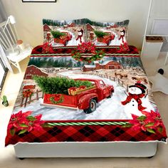 a bed with a red truck and christmas decorations on it