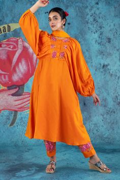 Orange balloon sleeve anarkali kurta, elevated with floral applique. Comes with pant and dupatta.
Components:3
Pattern:Applique,Threadwork
Type of Work:Floral
Neckline:Round Neck
Sleeve Type:Balloon Sleeves
Fabric:Cotton Satin
Color:Orange
Other Details:
Half button placket
Rose applique yoke
Occasion:Puja,Mehendi and Haldi - Aza Fashions Balloon Arch For Wedding, Round Balloon Arch, Arch For Wedding, Orange Balloons, Round Balloons, Rose Applique, Anarkali Kurta, Satin Color, Floral Applique