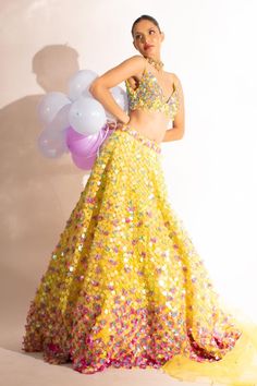 Yellow can can attached lehenga with sequin and pearl embellished floral motifs. Comes with matching padded blouse and dupatta.
Components: 3
Pattern: Embellished
Type Of Work: Sequin, Pearl
Neckline: V-neck
Sleeve Type: Sleeveless
Fabric: Net
Color: Yellow
Other Details: 
Attached lining
Lehenga Length: 46 inches
Weight: 7.5 kgs
Closure:
Lehenga: Side drawstring
Blouse: Back hook
Occasion: Sangeet,Cocktail - Aza Fashions Lehenga Pattern, Blouse Back, Padded Blouse, Types Of Work, Can Can, Floral Motifs, Set For Women, Aza Fashion, Floral Motif