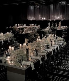 a long table is set with candles and flowers