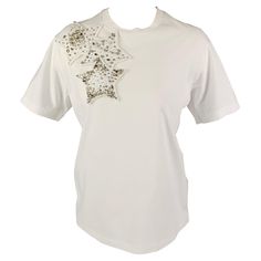 DSQUARED2 t-shirt comes in a white cotton featuring a loose fit, three star design, rhinestone embellishments, and a crew-neck. Made in Italy. Very Good Pre-Owned Condition. Light discoloration at back. As-Is. Marked: XS Measurements: Shoulder: 17.5 inches Bust: 38 inches Sleeve: 8 inches Length: 24.5 inches Reference: 121732 Category: T-Shirt - Womens More Details Brand: DSQUARED2 Size: XS Color: White Fabric: Cotton Pattern: Applique Style: Crew-Neck Age Group: Adult Gender: Female White Summer Tops With Star Logo, White Embellished Crew Neck T-shirt, White Embellished Crew Neck Top, White Embellished Cotton Tops, White Graphic Tee With Star Logo, White Short Sleeve T-shirt With Star Logo, Three Star, Star Designs, White Fabrics