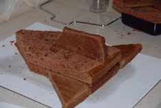 two pieces of toast sitting on top of a white paper towel in front of a blender