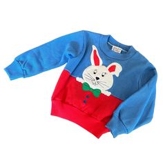 Vintage Bette’s Girls Crewneck Sweatshirt Size 18 Mos Blue And Red Features Smiling White Bunny With A Green Bow Tie Flat Measurements: Pit To Pit: 11” Length: 12” Sleeve Length: 11.25” Tag Barb Still Attached. Great Vintage Condition. Cute Blue Sweater For Playtime, Playful Blue Sweater For Spring, Blue Playful Sweater For Spring, Playful Blue Spring Sweater, Blue Long Sleeve Sweater For Playtime, Playful Sweater For Spring Playtime, Playful Spring Sweater For Playtime, Blue Cartoon Print Tops For Playtime, Cute Blue Winter Top