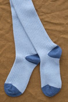 Experience ultimate comfort with the Hunter Green Rib Cashmere Knee Hi Socks by Hansel From Basel. Made with a luxurious blend of cashmere, polyamide, and wool, these socks offer a slim silhouette and knee-high style with ribbed detailing for a snug fit. Featuring a contrast heel and toe, these socks are a great subtle style. Classic Blue Winter Socks, Cozy Blue Socks For Fall, Blue Fitted Comfortable Socks, Blue Knee-high Winter Socks, Fitted Blue Knee-high Socks For Winter, Comfortable Fitted Blue Knee-high Socks, Fitted Blue Socks For Fall, Fitted Blue Winter Socks, Cashmere Socks