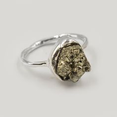 Natural Pyrite Raw Gemstone Ring, Solid 925 Ring, Pyrite Rough Stone Ring Jewelry, Golden Pyrite Raw Ring, Super Power Healing Gems Ring  Gemstone :  Pyrite Rough Gem Shape: Free Form Metal: 925 Sterling Silver Purity: 925 Parts Per 1000 Silver Polish: High Ring Size: All Size Available 🎁 Our products are totally handmade and made with high-quality gemstones and 925 sterling silver.  💎About Gemstone  Pyrite is the stone of protection and manifestation. It protects the wearer from negativities and evil thoughts. Also, it helps to achieve the goals set in life by its possessor.It is especially beneficial for those who have to travel rather regularly. We accept custom and personalized order. It can be change in the gemstone, ring design and ring size. Please send us message if you are inter Spiritual Sterling Silver Ring With Raw Stone, Sterling Silver Nugget Rings For Anniversary, Silver Rings With Raw Stone, Sterling Silver Rings With Raw Stone, Silver Raw Stone Anniversary Ring, Silver Rings With Raw Stone For Promise, Silver Raw Stone Ring For Anniversary, Silver Promise Ring With Raw Stone, Silver Anniversary Ring With Raw Stone