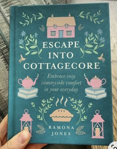 someone holding up a book about escape into cottage