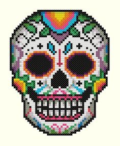 a cross stitch sugar skull with flowers on it's head, in the shape of a