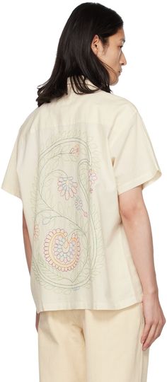 Handcrafted plain-woven cotton shirt. Floral graphics embroidered throughout. · Open spread collar · Button closure Supplier color: Off-white White Embroidered Camp Shirt For Spring, Casual Cotton Shirt With Chikankari Embroidery, Embroidered Cotton Tops With Camp Collar, Spring Embroidered White Camp Shirt, White Short Sleeve Tops With Tonal Embroidery, Cotton Camp Shirt With Floral Embroidery, Relaxed Fit Cotton Camp Shirt With Floral Embroidery, White Cotton Shirt With Chikankari Embroidery, White Cotton Tops With Tonal Embroidery