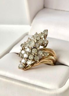 a gold ring with white diamonds in it