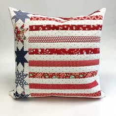 a red, white and blue pillow with stars on it