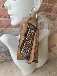 Handmade brown leather earrings with animal print accents Trendy Brown Hoop Earrings For Everyday, Trendy Brown Jewelry With Ear Wire, Chic Brown Dangle Jewelry, Handmade Brown Faux Leather Earrings, Handmade Leather Hoop Earrings, Handmade Brown Hoop Earrings For Everyday Wear, Everyday Handmade Brown Hoop Earrings, Brown Small Hoop Earrings As Gift, Brown Hoop Earrings With Ear Wire For Gift