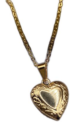 a gold heart pendant on a chain