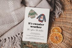 the sweater weather book is next to an orange slice