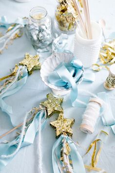 a table topped with blue and gold confetti