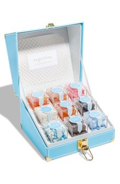 a blue box filled with lots of different colored candies