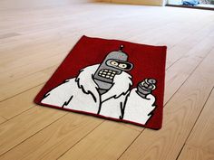 a rug with a cartoon character on it in the middle of a wooden flooring area