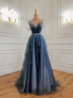 Stunning Blue Beaded Layers: Tulle Straps Long Formal Dress. Make a statement with this enchanting blue evening gown adorned with intricate beaded layers. #FormalFashion Tulle Formal Dress, Baju Kahwin, Prom Dress Blue, Formal Dresses Graduation, Elegant Ball Gowns, Blue Dress Formal, Graduation Dresses, Blue Evening Dresses, Fashion Designing