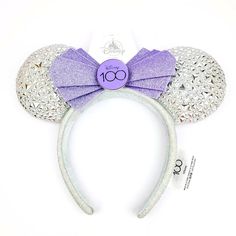 Disney Minnie Mouse Ears Headband Adults 100 Years Of Wonder Disney 100 Sparkle Silver With Purple Adornment. Available In One Size For Adult Or Child. Embroidered In Purple ‘Disney Cast Member’ Along Side Of Headband. Exclusive And Limited Cast Member Ears! Minnie Mouse Disney100 Ear Headband For Adults Soft Padded Minnie Mouse Ears Lurex Ears Accented With Platinum Colored Appliqus Glittering Purple Bow With Metal Disney100 Logo Centerpiece Lurex Headband Exterior Contrast Non-Slip Velour Inte Disney Minnie Mouse Ears, Disney Headbands, Butterfly Birthday Party, Disney Cast, Minnie Mouse Ears Headband, Purple Bow, Disney 100, Fun Crafts To Do, Mouse Ears Headband