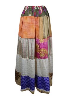 Embrace the seasons with this beautifully flared maxi skirt, handcrafted from recycled saree fabric in rich Beige, Orange, and floral prints. Featuring a comfortable drawstring waist and a graceful ankle-length silhouette, this boho-chic piece is perfect for everything from casual market strolls to vibrant beachside festivals. Designed to let your adventurous spirit shine, the skirt is available in one versatile size (S/M/L), offering a perfect blend of bold style and sustainability. Its captiva Skirt Patchwork, Flare Maxi Skirt, Boho Skirts, Saree Fabric, Bold Style, Bold Fashion, Ankle Length, Drawstring Waist, Boho Chic