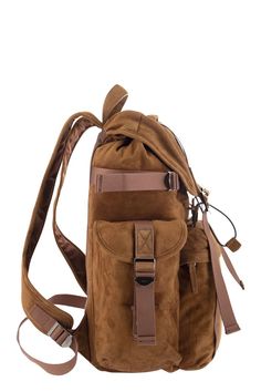 This stunning medium suede backpack is the epitome of luxury and functionality. Crafted with the finest suede leather, it features an adjustable shoulder strap and a convenient hand handle for easy carrying. The custom metal buckles and flap closure add a touch of elegance, while the flat top pocket and large front zipped pocket provide ample storage space for all your essentials. The practical flap pockets on the sides and fabric lining make this backpack a refined blend of craftsmanship and pr Suede Backpack, Tods Bag, Medium Backpack, Timeless Wardrobe Staples, Leather Cap, Custom Metal, Browning, Metal Buckles, Handbag Backpack