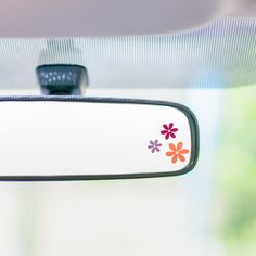 the rear view mirror has flowers painted on it