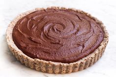 a chocolate pie sitting on top of a white counter