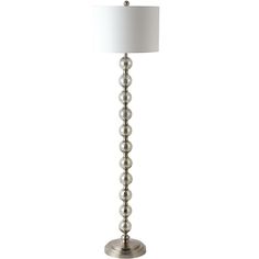 a silver lamp with a white shade on it