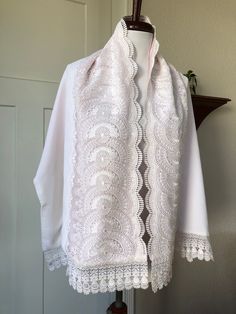 1960s-1970s era Japanese Kimono shawl. Probably meant for winter or special event. White velvet with shiny white scalloped floral lace. Lined in light pink material that peeps through the lace trim. In AS-IS condition; has numerous rust-colored age spots from being in storage (more notable on inner pink lining); please inspect photos.- Price is reflected. Measures approx: 17" x 58" White Vintage Shawl For Winter, Vintage White Winter Shawl, Vintage Embroidered Shawl For Spring, Pink Retro, White Velvet, Japanese Kimono, Retro Floral, Scalloped Edge, Shawls And Wraps