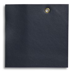 a black leather cover with a gold ring on it