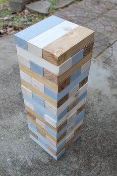 a tall wooden block sitting on top of a sidewalk