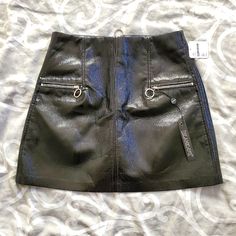 This Faux Leather, Aka Pleather, A-Line Mini Skirt Has Zippered Front Pocket Accents And Zippered Back Closure. The Faux Leather Has A Shiny Effect For Added Attention Grab. Wear With A Slouchy Sweater And Sneakers For A Cute Look Or Go Edgy With A Cropped Top, Oversized Blazer, And Boots. Never Worn. Faux Leather Skirt With Pockets For Night Out, Slouchy Sweater, A Line Mini Skirt, Blank Nyc, Oversized Blazer, Women Skirts Midi, Front Zipper, Womens Skirt, Mini Skirts