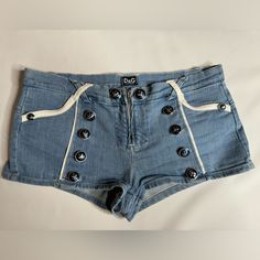 Enhance Your Wardrobe With These Stylish Authentic D&G Dolce & Gabbana Jean Short Sailor Hot Pants In Italian Size 44, Perfect For Any Fashionista. Please See Photos Showing Measurements. The Shorts Are Made From A Premium Quality Denim Providing Durability And Comfort, Making Them A Must-Have For Any Wardrobe. Smoke Free Home Fast Shipping Poshmark Ambassador Dolce And Gabbana Jeans, Dolce And Gabbana Blue, Sailor Pants, Jean Short, Jean Shorts, Dolce And Gabbana, Premium Quality, Womens Shorts, Wardrobe