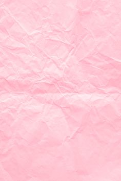 a piece of pink paper that is very wrinkled