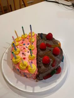 two pieces of birthday cake on a white plate