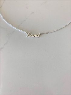 "Dainty Personalized Name Necklace 925 Sterling Silver * Custom Gold Name Necklace * Cursive, Tiny, Dainty Name Necklace * Silver Nameplate Necklace -------------------------------------------------- ♦ -------------------------------------------------- The beautiful personalized necklace, is dainty and in style. It can be worn everyday even in the shower. If you are looking for a gift for a dear loved one, think of this necklace - we can help you get it in time for any special event. ♦ Materials Silver Nameplate Necklace, Couple Initial Necklace, Celebrity Necklace, Nameplate Necklace Silver, Poppy Necklace, Coordinates Jewelry, Custom Bar Necklace, Sideways Initial Necklace, Name Necklace Silver