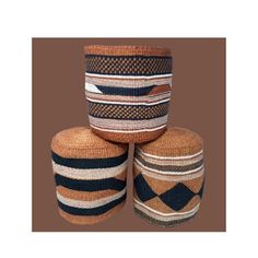 three baskets stacked on top of each other in front of a brown background with black and white stripes