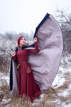 "Medieval half-circle cloak ending around ankle. This hooded cloak with fur provides protection from wind, rain and cold. Added fur makes it look more cozy and luxury at the same time. Cape closes at the collar with 2 durable leather loops and metal buttons. This cloak is a practical, elegant garment for any adventure. Available in many colors and with different fur. Inner cotton color as well as desired shades of faux fur (if chosen) can be specified in \"note to seller\". Please also write you Winter Long Sleeve Cape For Cosplay, Winter Costume Cape With Long Sleeves, Winter Cape For Costume Events, Medieval Winter Outerwear For Fantasy Events, Medieval Outerwear For Fantasy Events In Winter, Winter Long Sleeve Cape For Costume, Hooded Winter Cape For Fantasy Events, Hooded Cape For Fantasy Events In Winter, Fantasy Style Winter Costume Cape