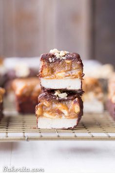 three pieces of dessert sitting on top of a cooling rack