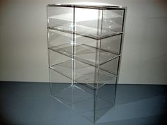 a glass display case with five shelves on top