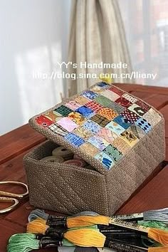 a sewing kit sitting on top of a wooden table