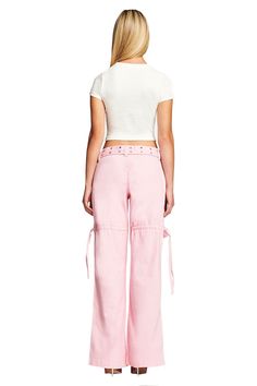 Details Best-selling Naima Cargo Pant is back Baby pink denim jean - Cargo pant style Low-rise waist and relaxed silhouette Double studded belt with silver buckle and eyelets Workable pockets throughout the front and back Featuring workable drawstring at thigh Unlined - This fabric is not sheer Recommended Underwear: Due to the low-mid rise, we recommend wearing this garment with a seamless low-mid brief Size and Fit True to size. We recommend wearing your standard size Low-rise waist - Sits app Cargo Pant Style, Pink Cargo Pants, Cargo Pants Style, Baby L, Pink Denim, Studded Belt, Cargo Pant, Pink Baby, Denim Jean