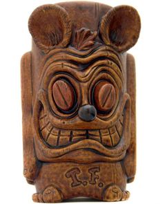 a carved wooden statue with ears and eyes