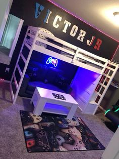 a room with bunk beds and video game controllers on the rug in front of it