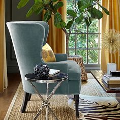 a living room filled with furniture and a tree